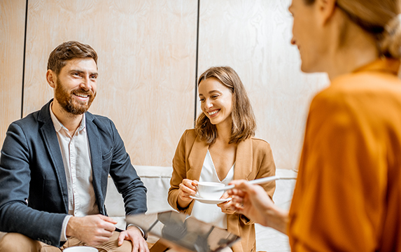 Young couple talking with financial advisor