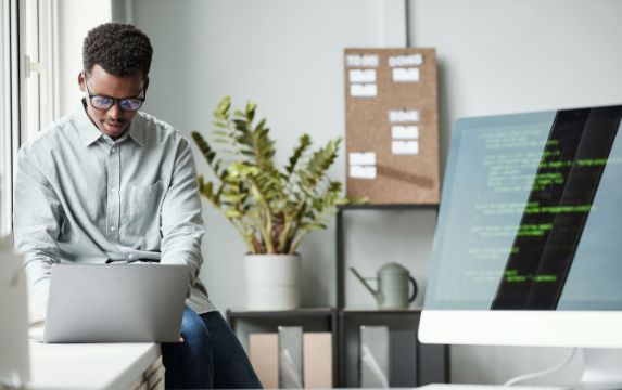 Young software developer working in an office