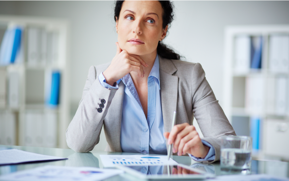 Female financial advisor contemplating independence