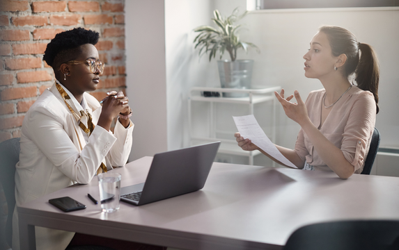 Woman engaging with advisor as financial coping resource