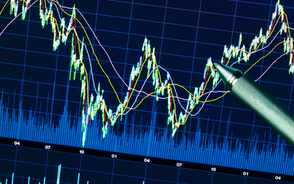 Graph on computer screen showing stock market volatility