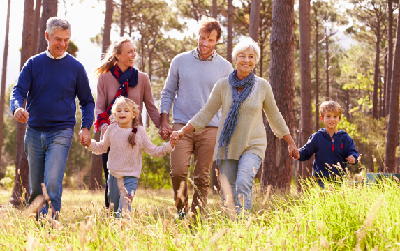 Multi-generational family enjoying a hike outside