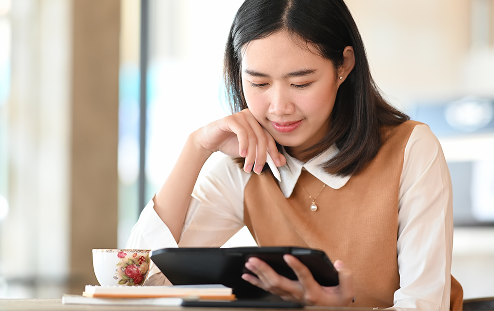 Female financial advisor reading on tablet