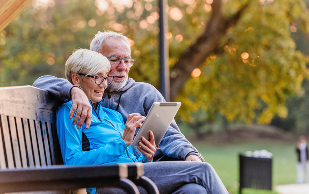 Older couple using a client portal on their tablet