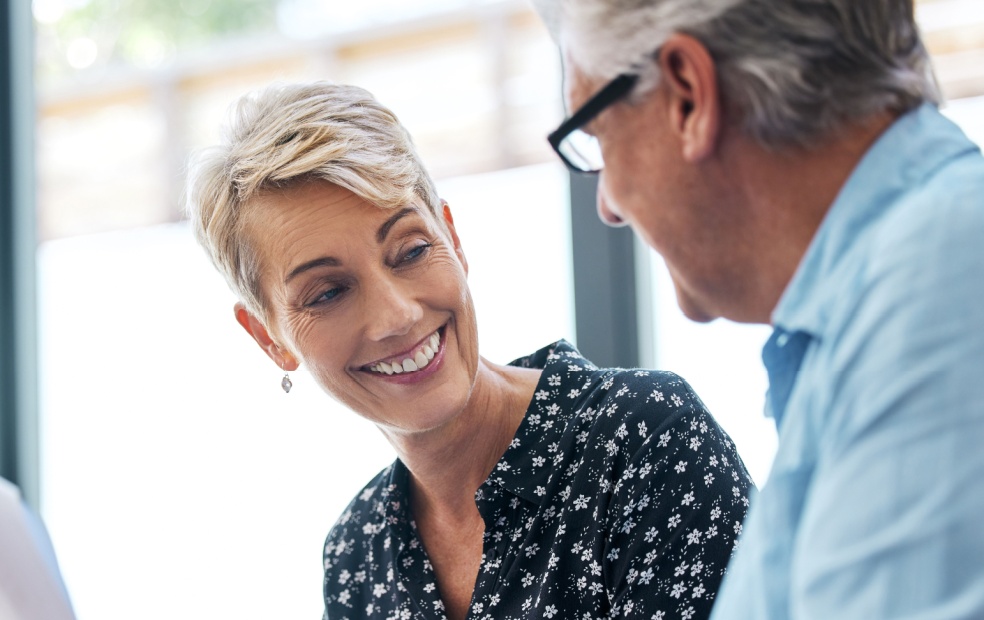 A financial advisors speaks with their client.