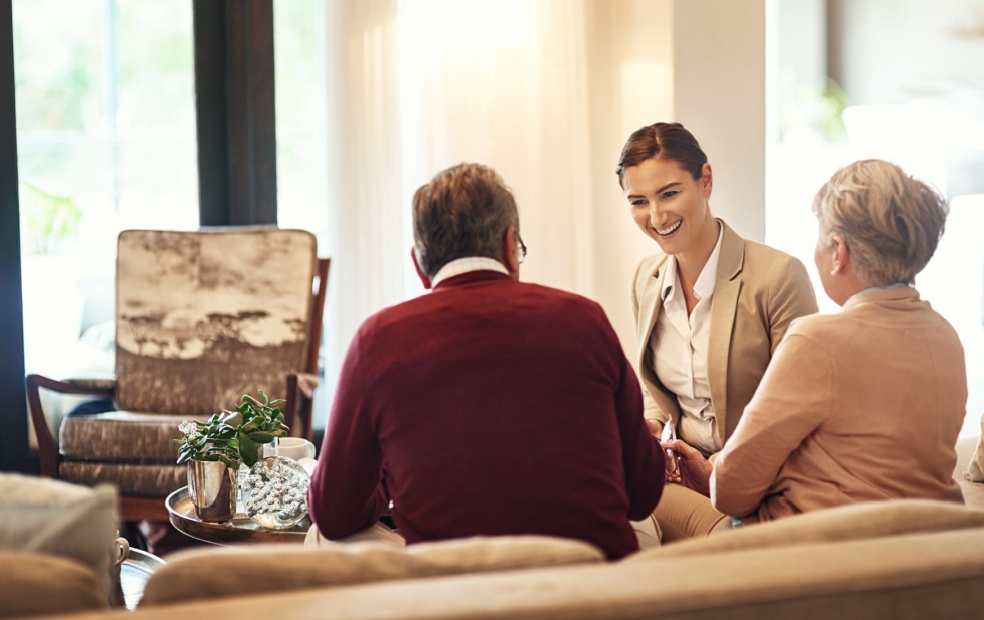 A financial advisor meeting with their clients.