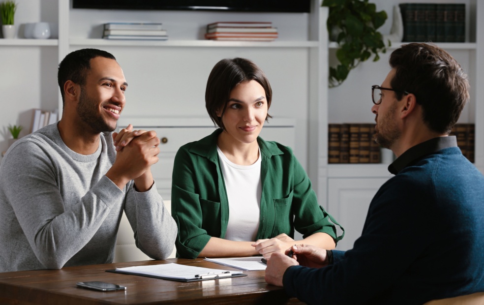 Financial advisor and clients talking about values in office