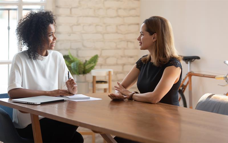 Two financial professionals holding a meeting.