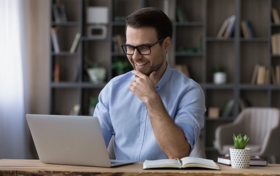 A financial advisor works in their office.