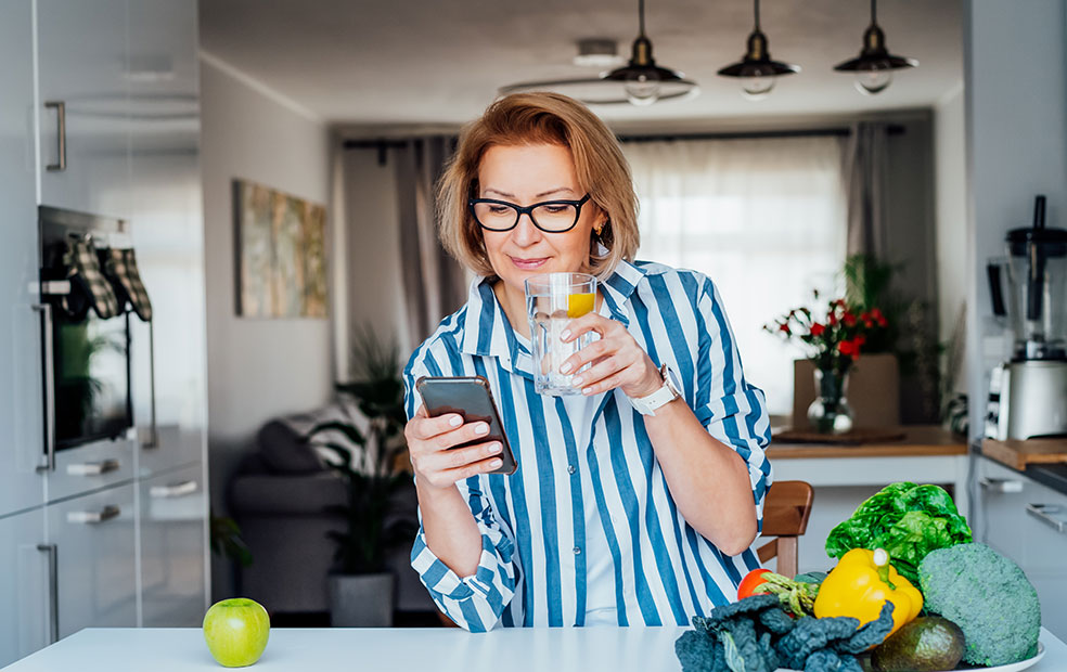 Woman embracing healthy habits and using cellphone
