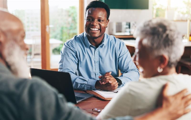 A financial planner meets with an older couple.