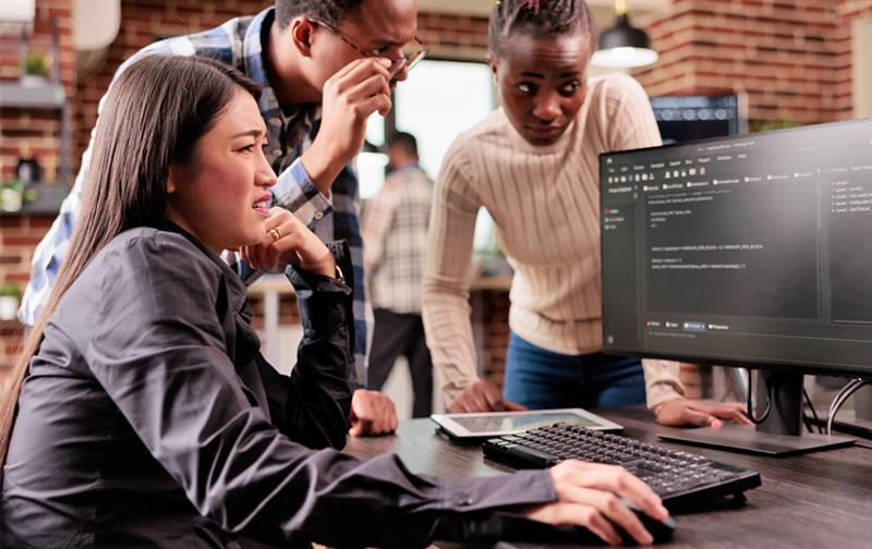 A financial planner working on their computer.