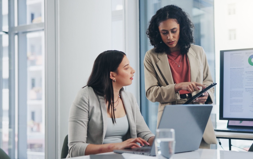 Financial advisors conferring about their financial planning software