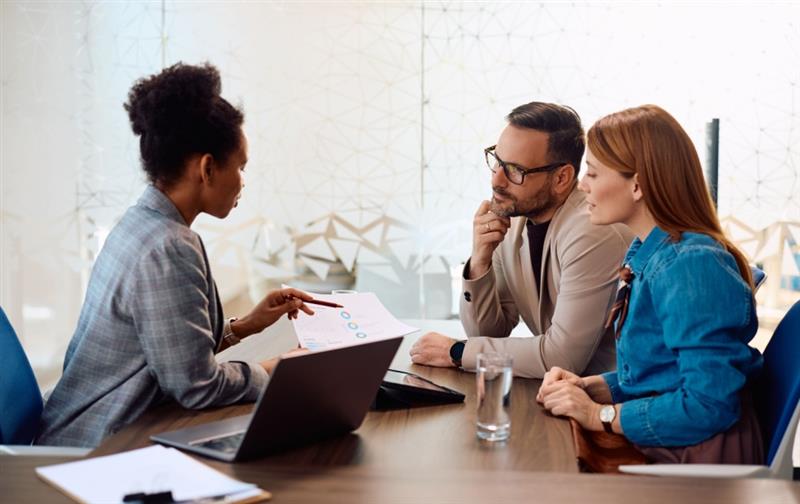 A financial advisor meeting with clients.