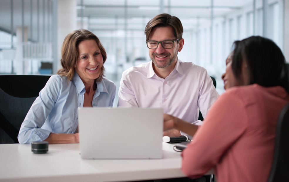 A financial planner meeting with a couple.