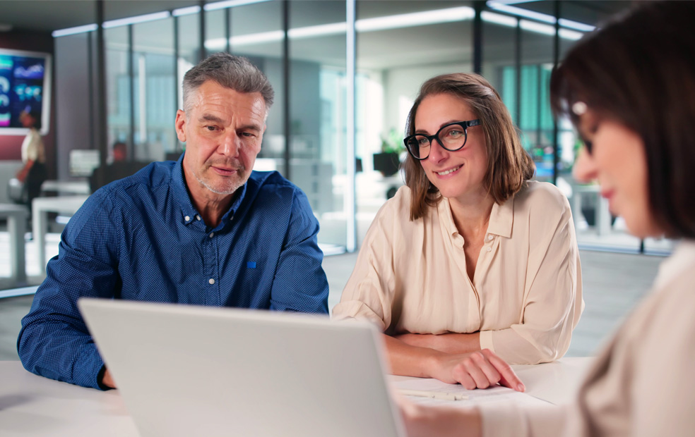 A financial advisor meeting with a couple.