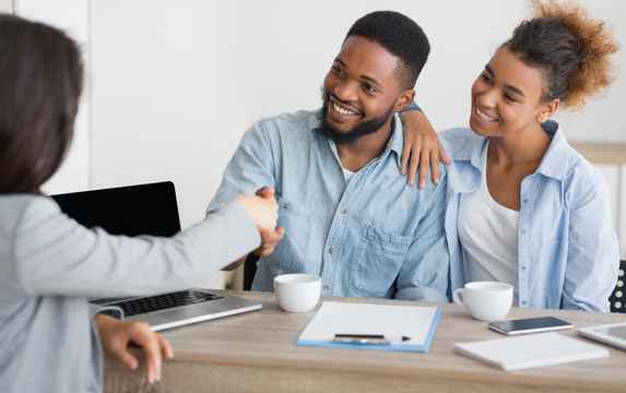 African American couple Meets with white financial advisor