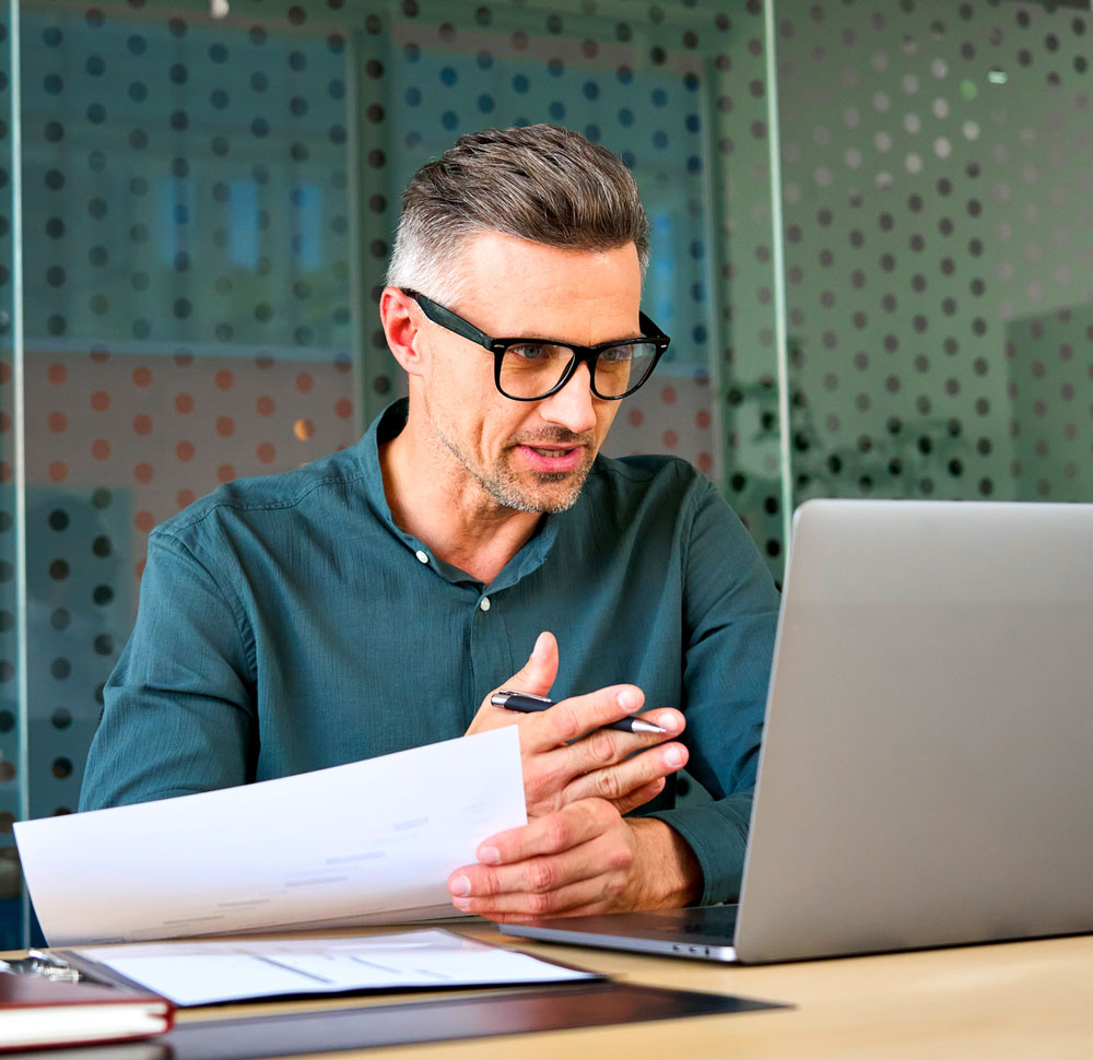 person working at a desk on a call