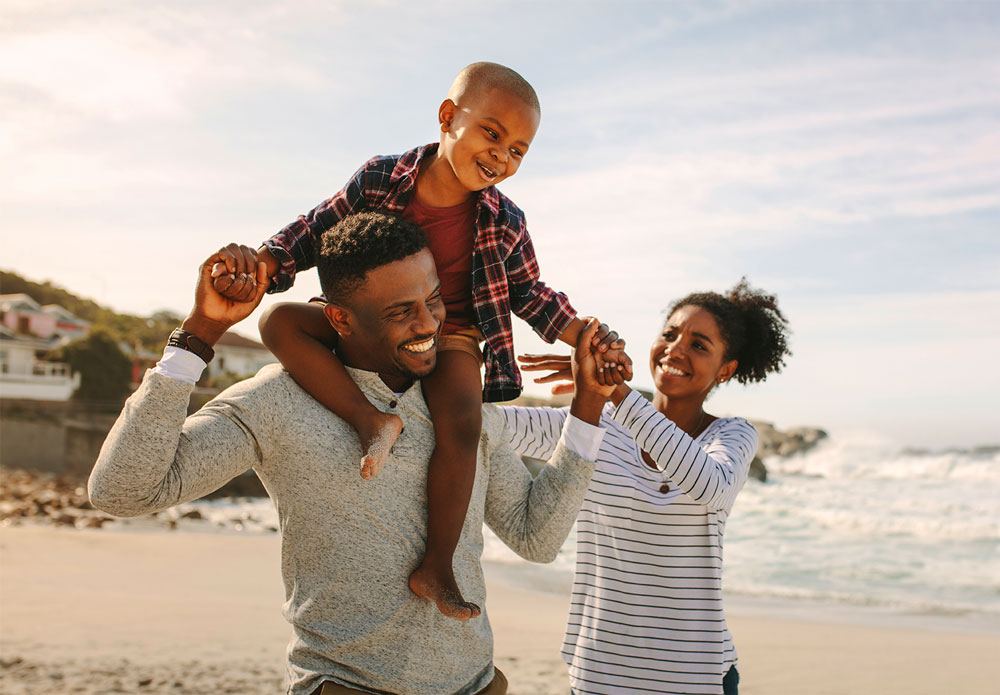 Happy family enjoying time on the beach