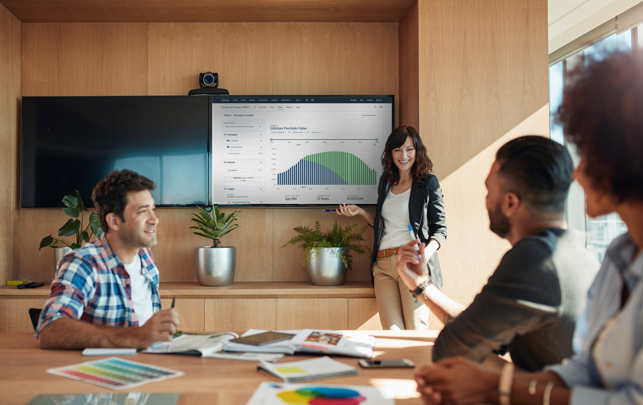 co-workers in a meeting with decision center on the big screen