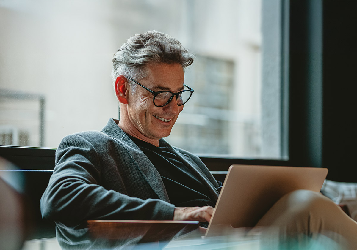 person feeling happy and confident on their device